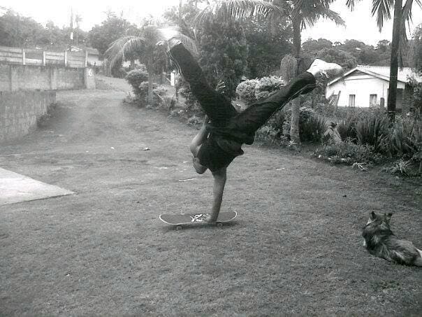  Picture of Kyle doing a one hand handstand on a skate board