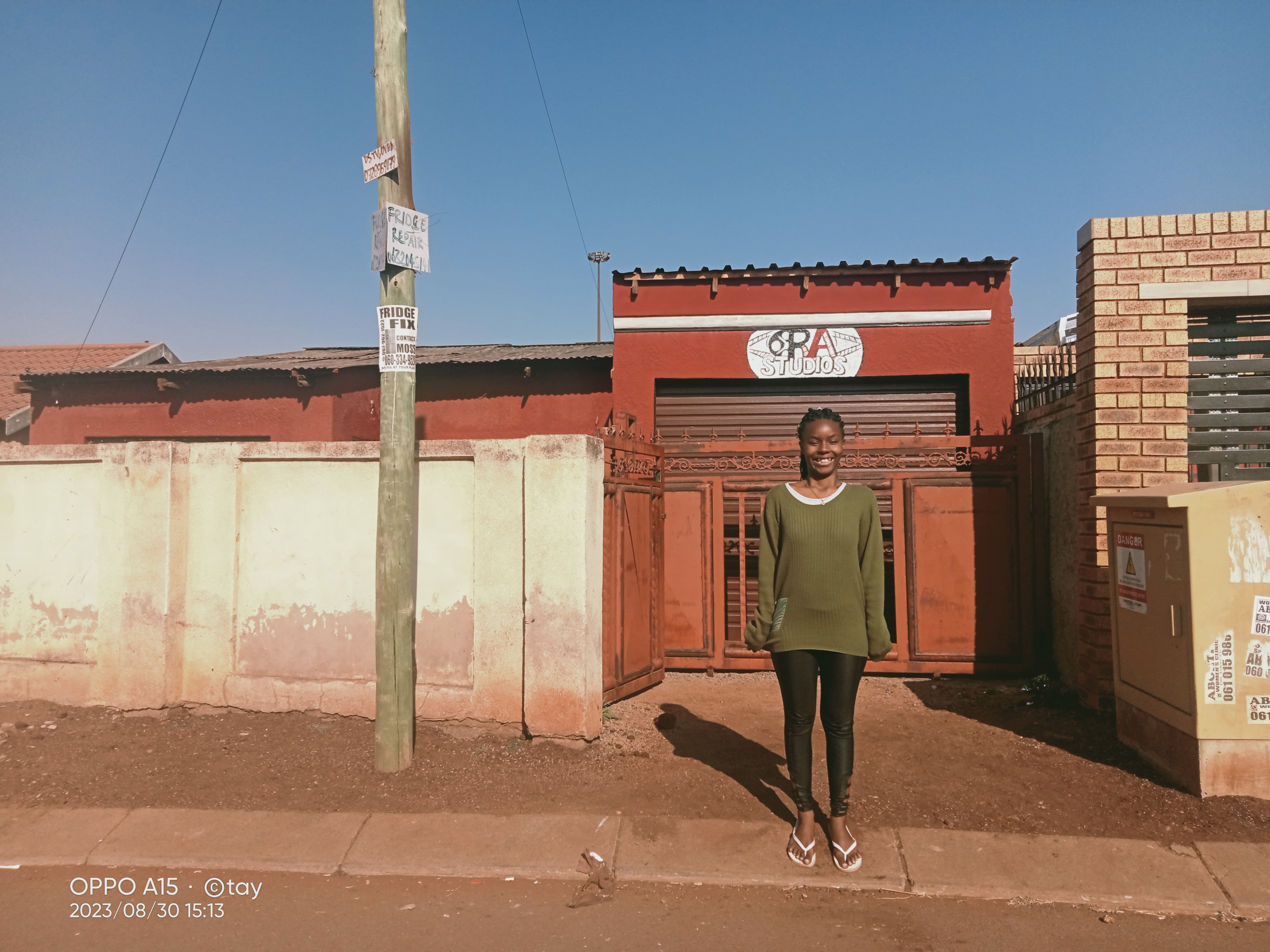 picture of thato in front of her family home